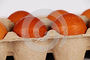 Brown eggs in egg box
