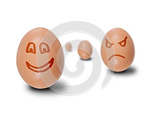 Brown eggs with faces drawn