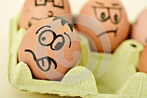 Brown eggs with funny faces
