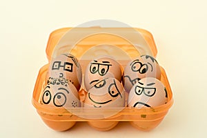 Brown eggs with funny faces