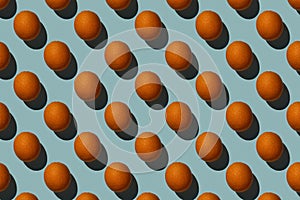 Brown eggs pattern on blue background Hard shadows