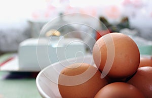 Brown eggs in a white bowl