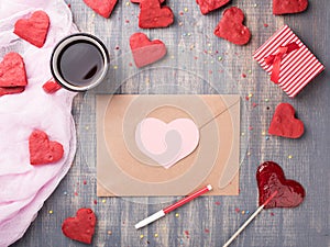 Valentine`s day love letter on wooden background.