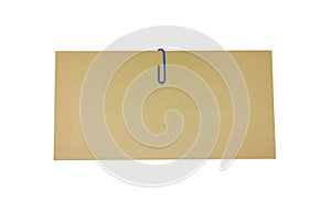 Brown envelope with clipping path. A blue paper clip and a envelope isolated on white background