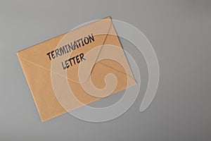 Brown envelope written with TERMINATION LETTER. Unfair dismissal concept