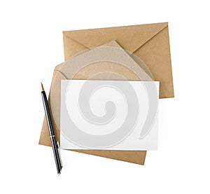 Brown envelopes, blank letter and pen isolated on white, top view