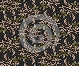 Brown fabric pattern with natur inspired element and forms. Taupe repeating flower pattern. photo