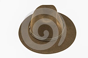 Brown felt hat, taken from the front, isolated against a white background