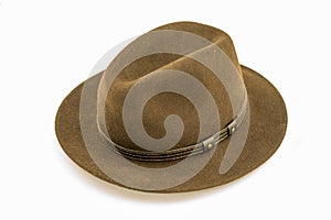 Brown felt hat, taken from the side, isolated against a white background