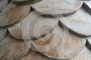 Brown flakes in the sunlight, wooden squama background