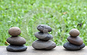 Brown flat stones in blance in the garden on the f