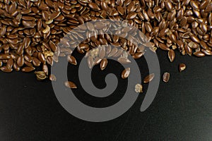 Brown Flax seed. Also known as Linseed, Flaxseed and Common Flax. Closeup of grains, background use