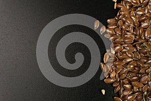 Brown Flax seed. Also known as Linseed, Flaxseed and Common Flax. Closeup of grains, background use