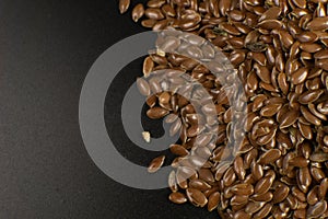 Brown Flax seed. Also known as Linseed, Flaxseed and Common Flax. Closeup of grains, background use