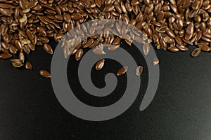 Brown Flax seed. Also known as Linseed, Flaxseed and Common Flax. Closeup of grains, background use