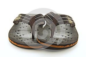 Brown flip flops on a white background
