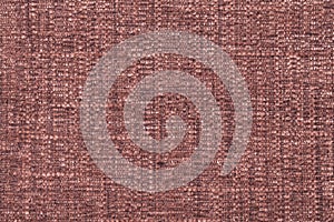 Brown fluffy background of soft, fleecy cloth. Texture of textile closeup
