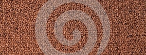 Brown fluffy background of soft, velour fabric. Texture of umber wool textile