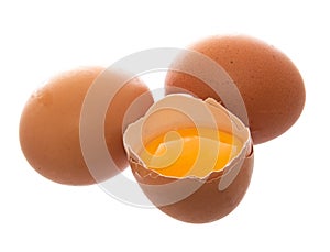 Brown fresh eggs with one broken.