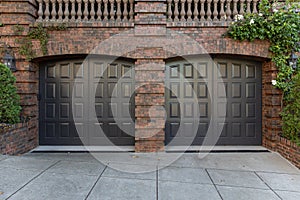 Brown garage door with brick exterior