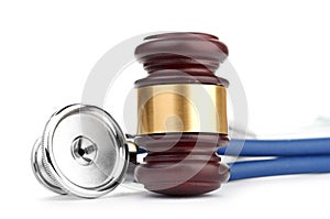 Brown gavel and a medical stethoscope