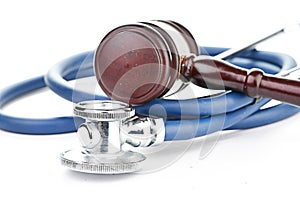 Brown gavel and a medical stethoscope