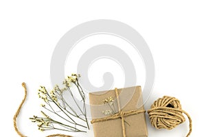 Brown gift boxes and rope with yellow limonium caspia flowers