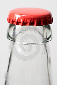 Brown glass bottle and red cap. Beer bottle