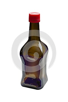 Brown glass bottle with red cork