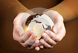 Brown Glass globe in hand