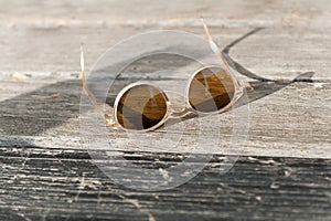Brown glasses lying in the sun