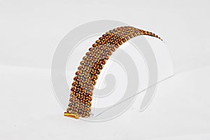 Brown and gold hand stitched flat beaded bracelet