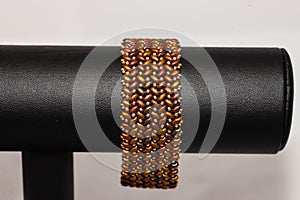 Brown and gold hand stitched flat beaded bracelet