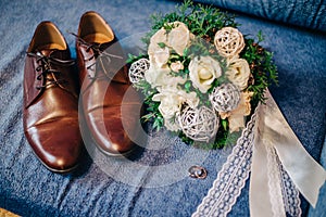 Shoes, wedding rings and bouquet