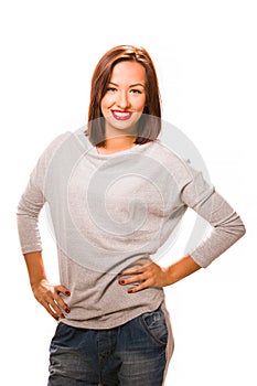 Brown hair beautiful woman with hands on hips wearing grey shirt