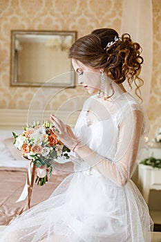 Brown-haired woman with classic wedding hair-style.