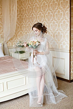 Brown-haired woman with classic wedding hair-style.