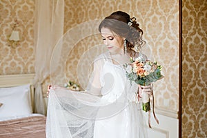 Brown-haired woman with classic wedding hair-style.