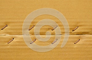 Brown hard paper box with metal wire tacked background and texture