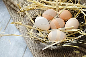 Brown hen eggs in a basket