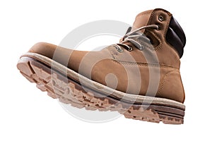 Brown high boot made of nubuck leather, concept, on a white background, as if hanging in the air, bottom view, winter shoes for an