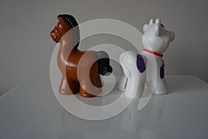 Brown horse and white cow plastic toys for child