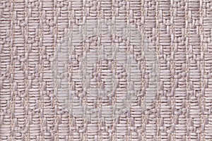 Brown knitted woolen background with a pattern of soft, fleecy cloth. Texture of textile closeup.