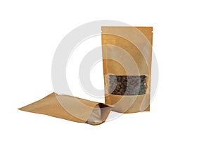 Brown kraft paper pouch bags with coffee beans front view on a white background