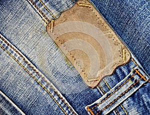 Brown label on blue jeans