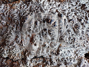 Brown lava rock background texture. Clinker wall or ground rusty