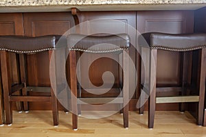 Brown leather barstools at home