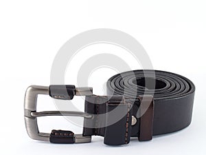 roll of dark brown leather belt with silver metal buckle isolated on white background with copy space