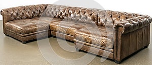 Brown leather couch with a checkered pattern
