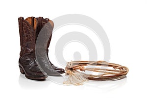 Brown leather cowboy boots on white